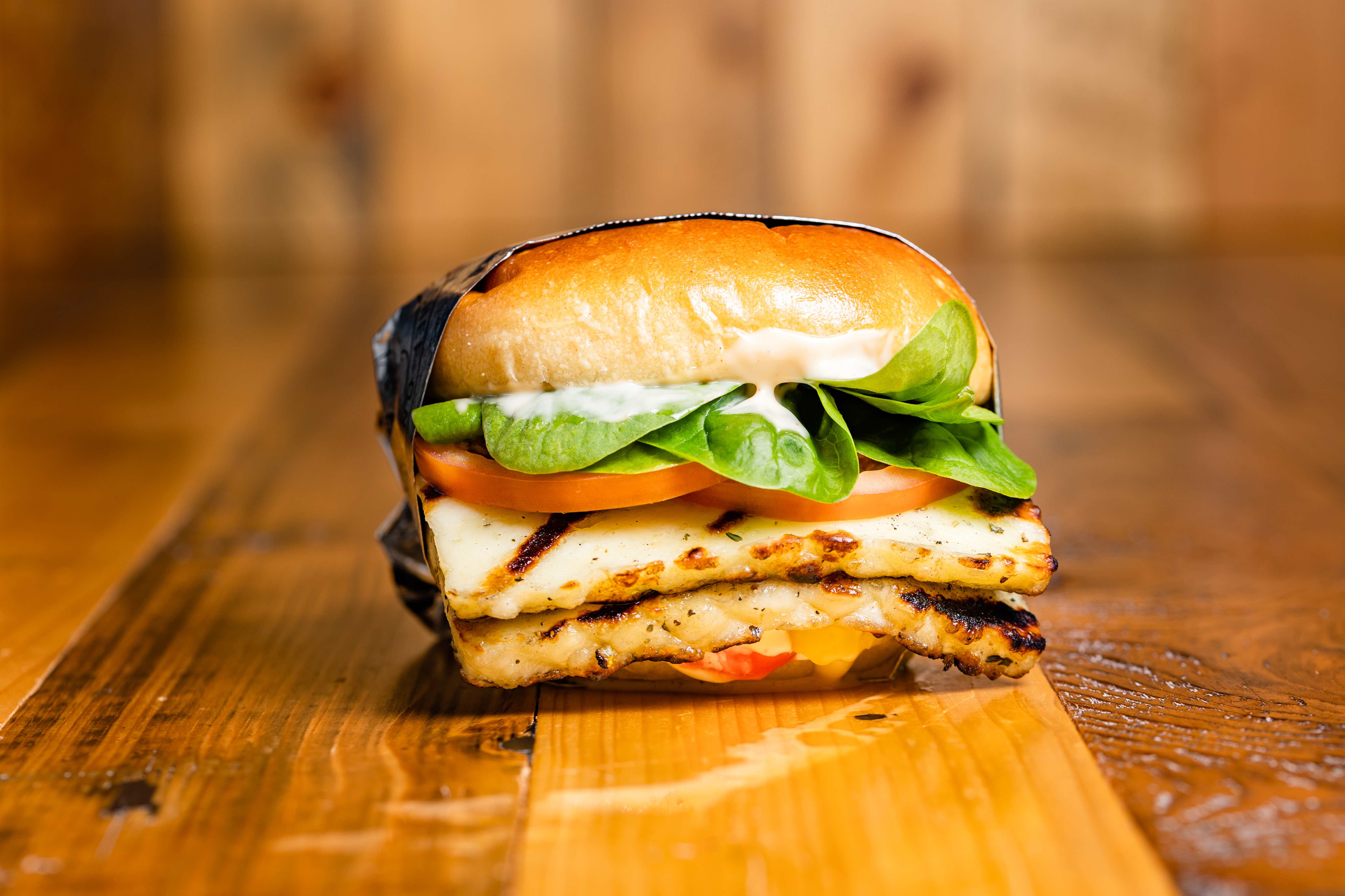 Boomi Halloumi - Golden-seared halloumi patty on an Ace Bakery brio...